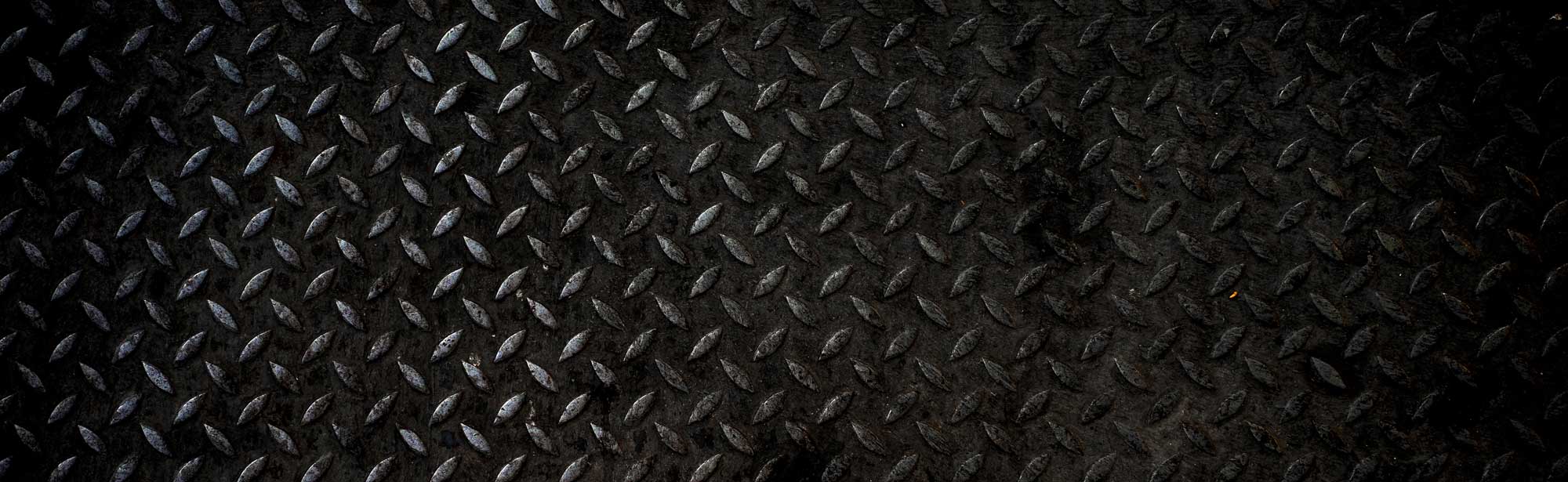 Textured metal background behind call-to-action, Dave Ward's Towing